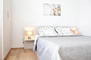 Posteľ alebo postele v izbe v ubytovaní Villy City Apartment