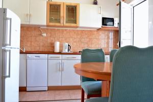 Kuchyňa alebo kuchynka v ubytovaní Villy City Apartment