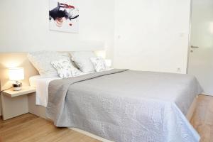 Posteľ alebo postele v izbe v ubytovaní Villy City Apartment