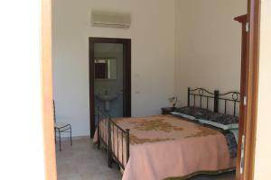 A bed or beds in a room at Masseria Cricelli