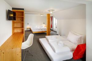 Hirschen Guesthouse - Village Hotel客房内的一张或多张床位