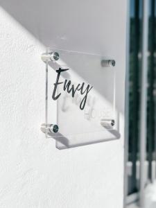 a sign that says unhappy hanging on a wall at Milea Mansion in Limassol