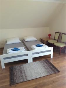 Łóżko lub łóżka w pokoju w obiekcie Pokoje i Apartamenty u Anny