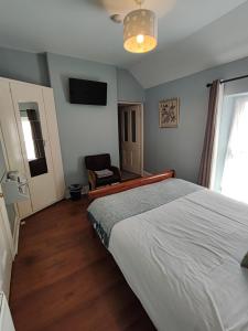 Postel nebo postele na pokoji v ubytování Rolling Wave Guesthouse