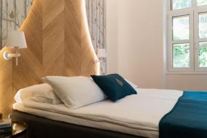 Postel nebo postele na pokoji v ubytování Hotel Starkl - Heritage & Unique