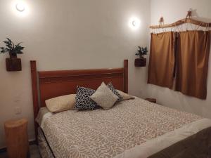 Tempat tidur dalam kamar di Casa Gekos Cuijas