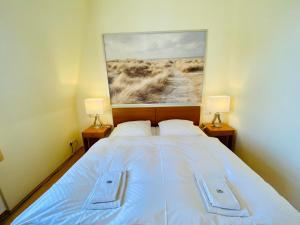 En eller flere senge i et værelse på Villa Schlossbauer - Ferienwohnung 12