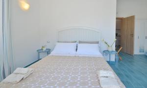 Postel nebo postele na pokoji v ubytování Casa OIKIA Anacapri