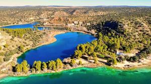 an aerial view of a lake with trees at RUIDERA HOLIDAY in Ruidera