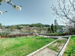 a garden with trees and a fence at Milea Mansion in Limassol