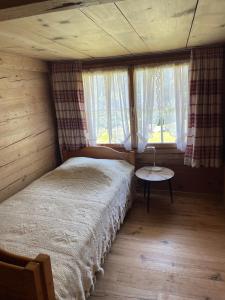 Ένα ή περισσότερα κρεβάτια σε δωμάτιο στο Ferienwohnung im Grünen