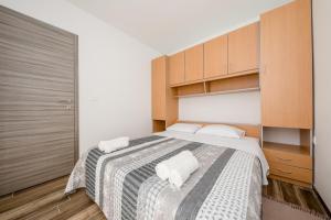 Postel nebo postele na pokoji v ubytování Apartments Gael