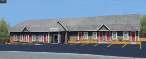 Newfound Inn & Suites في Topsail: تقديم مبنى مدرسة ذات مصاريع حمراء