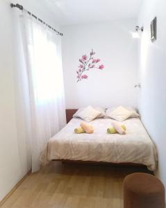 Postel nebo postele na pokoji v ubytování Apartment Sandra