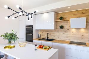 Kuchyň nebo kuchyňský kout v ubytování Apartmani Ana