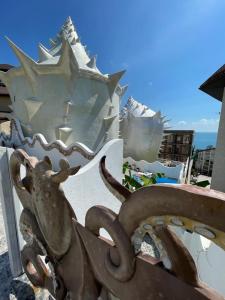 a metal statue of an octopus next to a building at SEASHELL апартаменты in Sochi