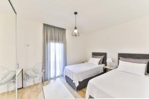 Postel nebo postele na pokoji v ubytování Apartmani Ana + 37 fotografií