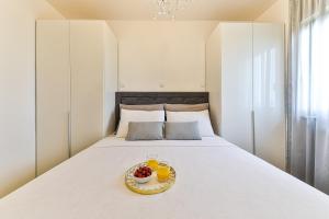 Postel nebo postele na pokoji v ubytování Apartmani Ana