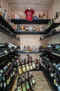 a room filled with lots of bottles of wine at Draconerium Hotel in Dronero
