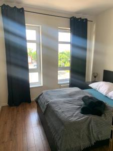 Posteľ alebo postele v izbe v ubytovaní Apartament Batory