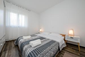 Postel nebo postele na pokoji v ubytování Apartments Gael
