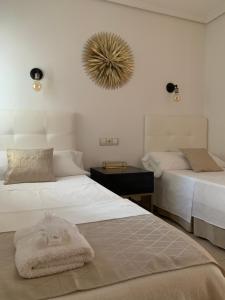 A bed or beds in a room at Playa de Levante Sea View Apartment