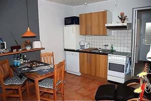 a kitchen and dining room with a table and chairs at Schlichte in Kirchdorf