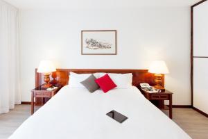 Postel nebo postele na pokoji v ubytování Aparthotel Adagio Rome Vatican