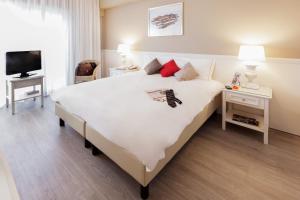 Postel nebo postele na pokoji v ubytování Aparthotel Adagio Rome Vatican
