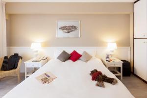 Postel nebo postele na pokoji v ubytování Aparthotel Adagio Rome Vatican