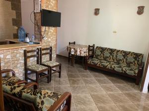 a living room with chairs and a couch and a table at Ashour Tower Ramy Abdulla For Families only in Marsa Matruh