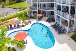 an aerial view of a swimming pool at a hotel at Lantana Resort Barbados by Island Villas in Saint James