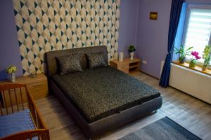 Katil atau katil-katil dalam bilik di LUX Apartman Maroslele