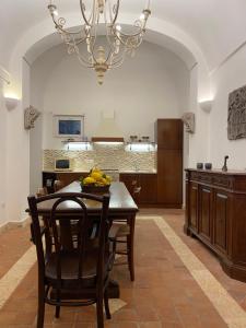 a kitchen with a table with bananas on it at La Casa Rossa in Maiori