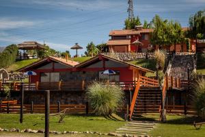 a house with stairs leading up to it at Posada Cacheuta in Las Compuertas