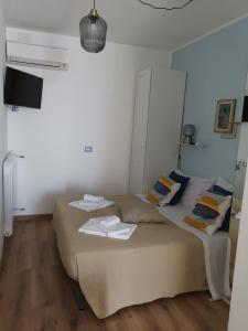 Postel nebo postele na pokoji v ubytování Loft Profumo di Mare