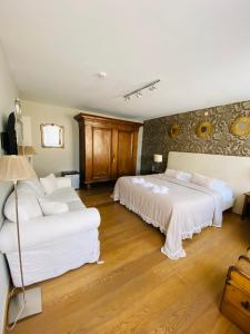 Säng eller sängar i ett rum på Gasthof Maerlant