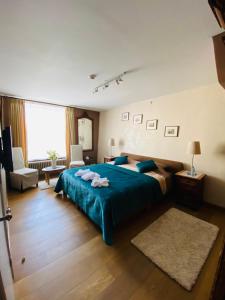 Säng eller sängar i ett rum på Gasthof Maerlant
