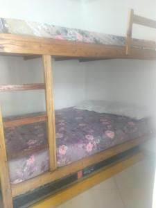 a bunk bed in a room with a mattress at AP mobiliado em Guaibim in Guaibim