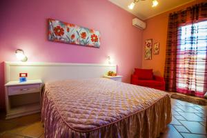 A bed or beds in a room at Profumo di Zagara