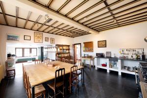 a large dining room with a table and chairs at Domaine de Priesmont in Vielsalm