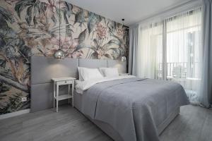 Posteľ alebo postele v izbe v ubytovaní Apartament Pastelowa Portova
