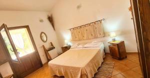 A bed or beds in a room at Agriturismo La Cresta