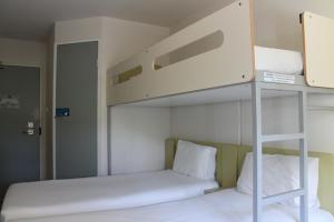 Кровать или кровати в номере ibis Budget - Melbourne Airport