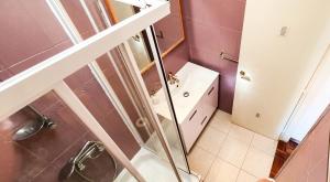 a bathroom with a shower and a toilet at Ericeira Surf Camp in Ericeira