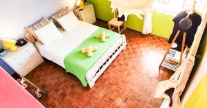 a bedroom with a bed with two crosses on it at Ericeira Surf Camp in Ericeira