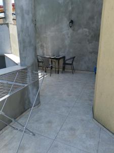 an empty room with chairs and a table in a building at Casa George Mamaia Nord in Mamaia Nord +45 photos