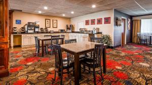 a kitchen with a table and chairs in a room at Best Western Plus Brandywine Inn & Suites in Monticello