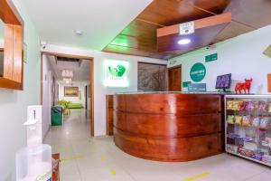 a pharmacy with a large wooden barrel in the middle of a store at Ayenda Hotel Las Palmas in Bogotá