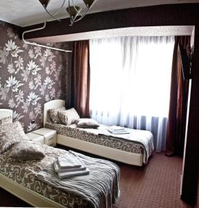 Hotel Lime tesisinde bir odada yatak veya yataklar